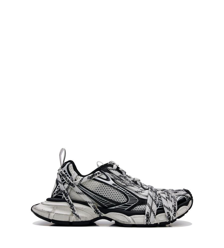 Balenciaga 3XL Extreme Laces Logo Sneaker in white and black with oversized silhouette, worn-out effect, multiple logo laces and reflective pull tabs.