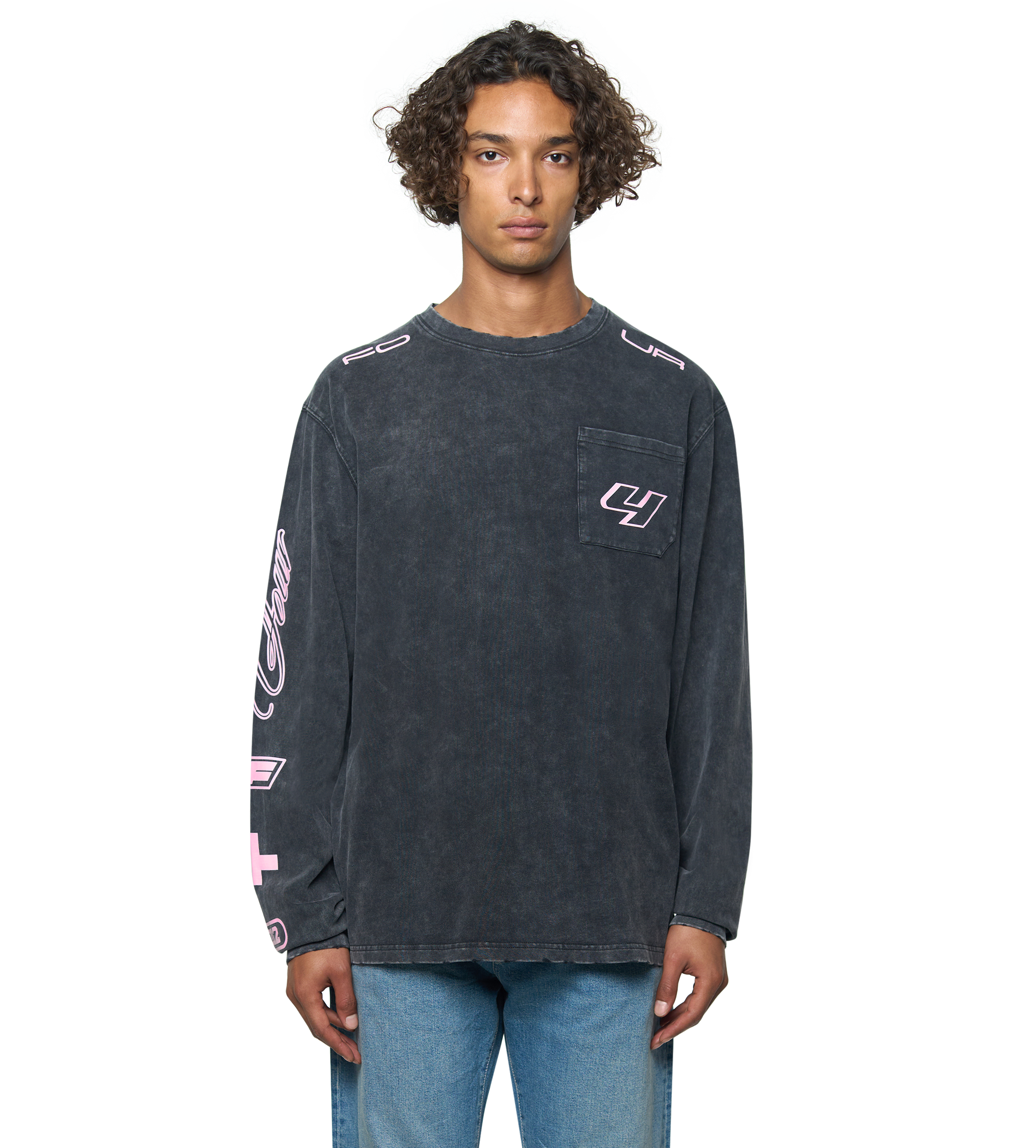 Person wearing a dark long-sleeve shirt with logos on a white background