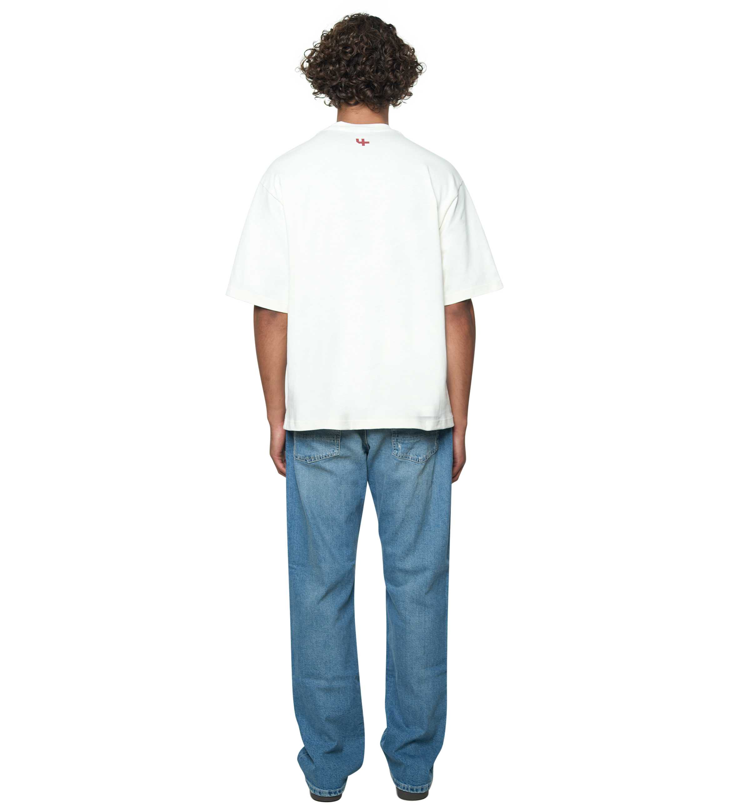 Person wearing a white t-shirt and blue jeans on a white background