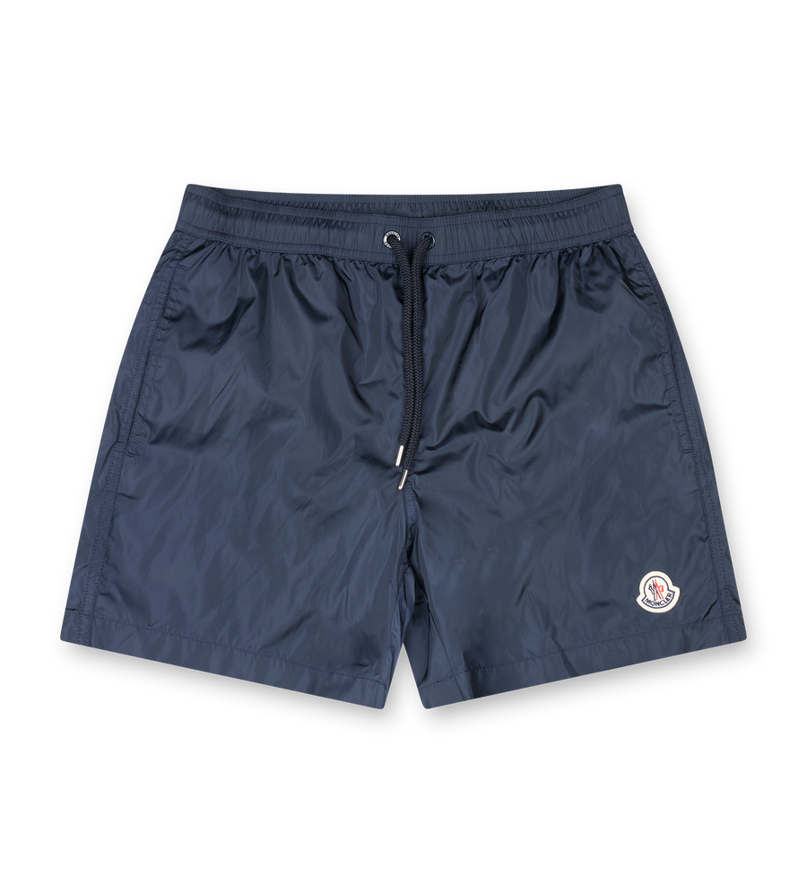 Moncler navy nylon swim shorts with drawstring waist, side pockets, zipped back pocket and silicone logo patch
