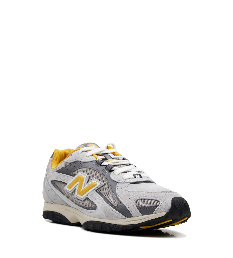 New Balance 2004L Sneakers in Grey and Yellow