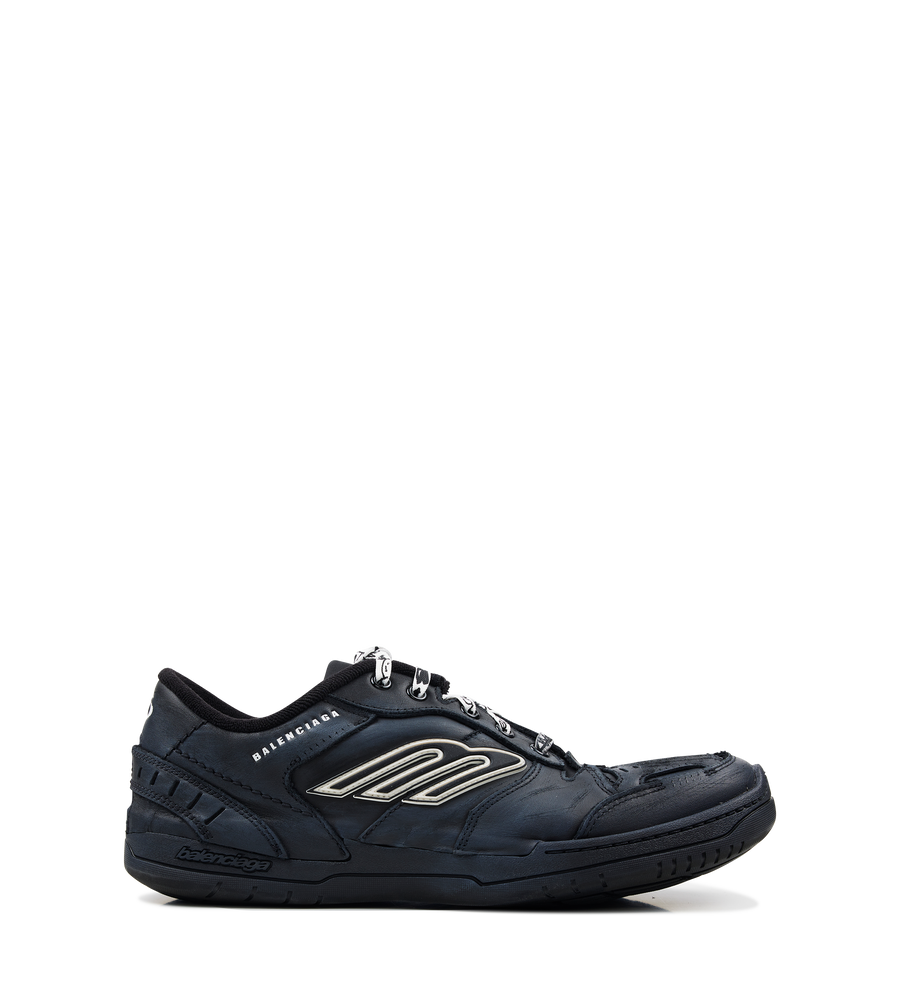 Balenciaga Men’s Hamptons Worn-Out Sneaker in black suede and polyester with distressed finish, scribbled laces and embossed branding.