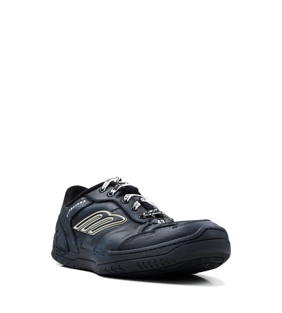 Balenciaga Men’s Hamptons Worn-Out Sneaker in black suede and polyester with distressed finish, scribbled laces and embossed branding.