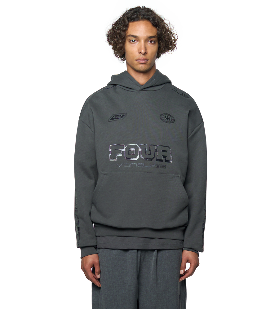 Person wearing a gray hoodie with branding on a white background