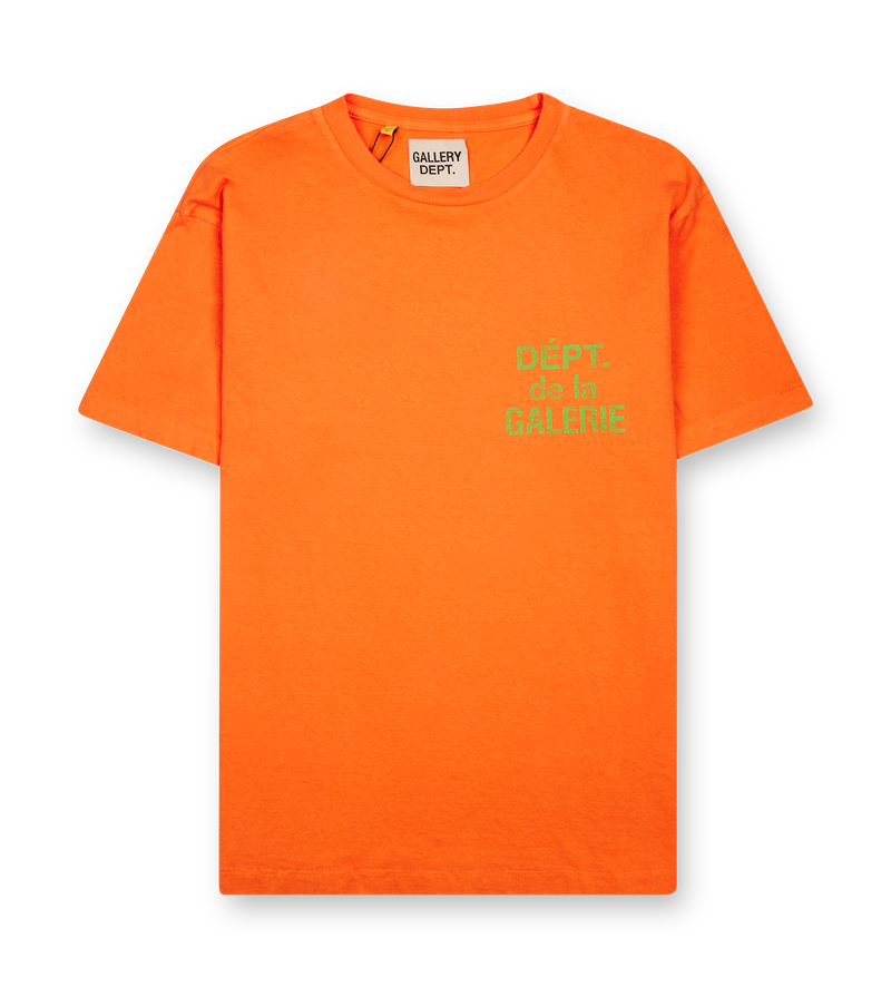 Gallery Dept Dept de la Galerie T-Shirt in Orange — short-sleeved cotton tee with printed yellow logo on chest and back, photographed flat on white background.