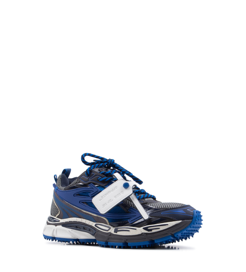 Off-White Be Right Back Sneakers in white and grey — mesh and synthetic leather sneakers with arrow motifs, branded tongue and Zip Tie tag, photographed on a light background.