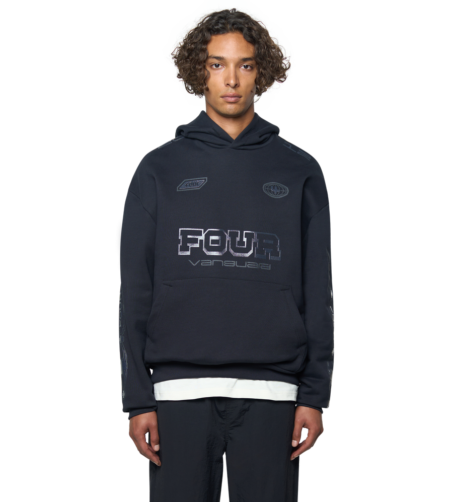 Person wearing a navy hoodie with branding on a white background